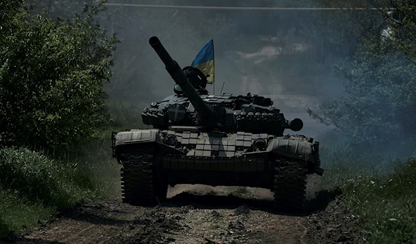 A Ukrainian tank rides near Bakhmut, in the Donetsk region, Friday, May 12, 2023. (AP)