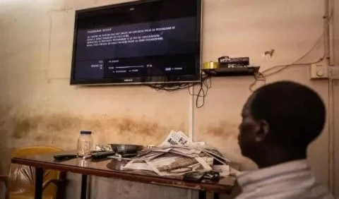 A television shows the cut signal of the France 24 channel, hours after Burkina Faso’s military government suspended the channel on March 27, 2023. (AFP)