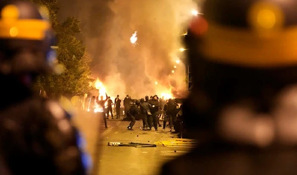 Police forces face youths during clash in Nanterre, outside Paris, Thursday, June 29, 2023 (AP)