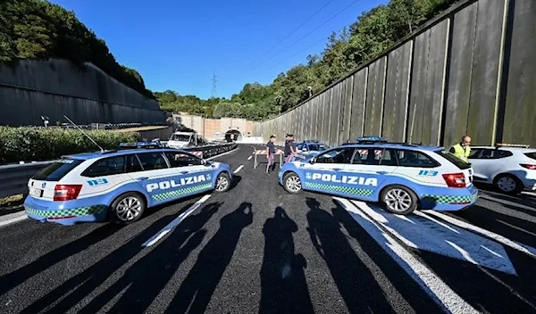 Italian highway patrol officers man a road block. (AFP)