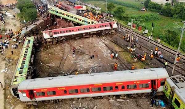 A drone view shows derailed coaches after two passenger trains collided in Balasore district in the eastern state of Odisha, India, June 3, 2023. (Reuters)