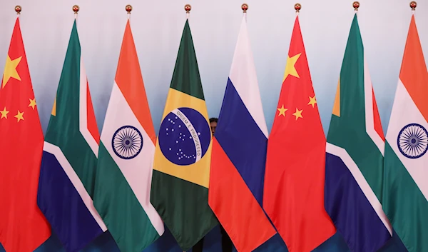 The national flags of China, South Africa, India, Russia, and Brazil are put up ahead of a group photo of the participants in the BRICS summit, Xiamen, China, September 4 2017. (Reuters)