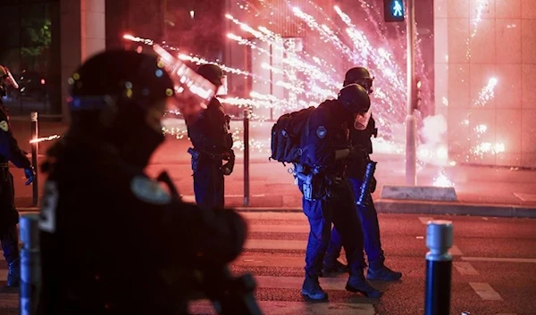 Riot police face off protestors on the third 3rd night of protests sparked by the fatal police killing of Nahel M. in the Paris suburb of Nanterre, France, Thursday, June 29, 2023. (AP)