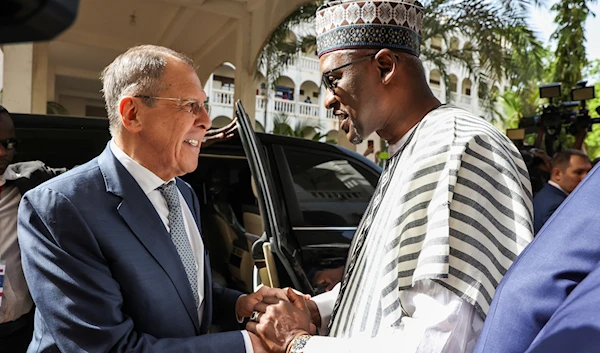 In this handout photo released by Russian Foreign Ministry Press Service, Mali's Foreign Minister Abdoulaye Diop, right, welcomes Russia's Foreign Minister Sergey Lavrov during their meeting in Bamako, Mali, Tuesday, Feb. 7, 2023.  (AP)