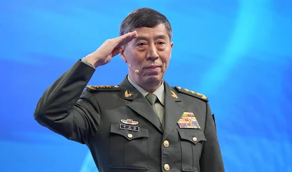 Chinese Minister of National Defense, Li Shangfu, performs military salute before speaking at Shangri-La Dialogue summit in Singapore, June 4 2023. (AP)