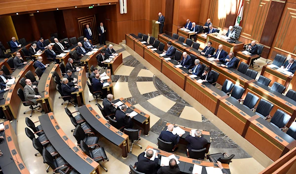 In this photo released by the Lebanese Parliament media office, Lebanese lawmakers attending a parliament session, in Beirut, Lebanon, April 18, 2023 (AP)