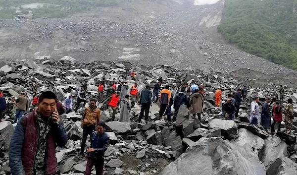 Rescue workers were frantically searching for survivors feared buried beneath rocks in Sichuan, June 2017 (Reuters)