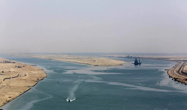 Work is currently underway to connect the tugboats to the ship in preparation for towing. (AP)