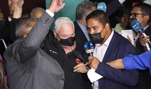 Panama's former President Ricardo Martinelli, center, talks to reporters as he leaves a courthouse after he was found not guilty of political espionage, in Panama City, Tuesday, Nov. 9, 2021. (AP)