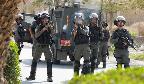 Israeli occupation forces target Palestinians with weapons in Areeha, West Bank, Occupied Palestine, March 1 2023. (Reuters)