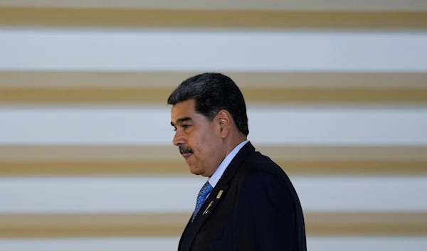 Venezuela's President Nicolas Maduro walks past after attending the South American Summit at Itamaraty palace in Brasilia, Brazil, May 30, 2023 (AP)