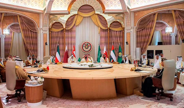 In this photo made available by Saudi Press Agency, SPA, Saudi Crown Prince Mohammed bin Salman, talks with Gulf Arab leaders during the Gulf Cooperation Council (GCC) Summit, in Riyadh, Saudi Arabia, Friday, Dec. 9, 2022.