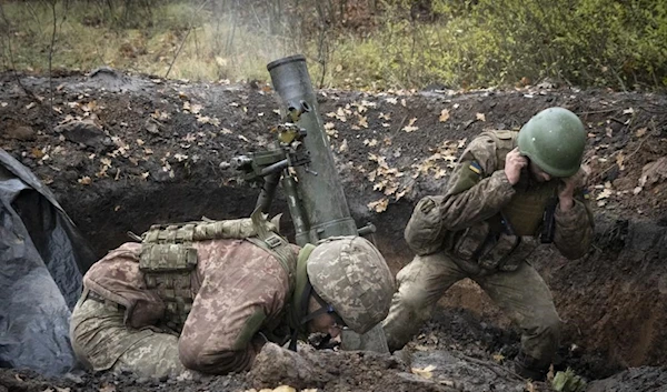 Ukrainian soldiers fire a mortar in the front line near Bakhmut, in the Donetsk Thursday, Oct. 27, 2022 (AP)