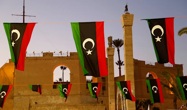 Libyan flags are displayed as people celebrate the February Revolution Day in Martyrs' Square in Tripoli, Libya, Friday, Feb. 18, 2022. (AP)