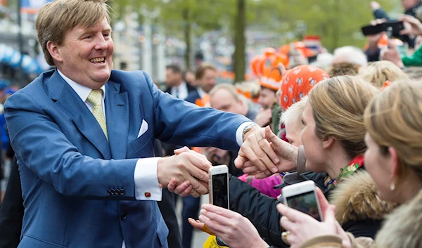 Dutch King Willem-Alexander shakes hands of well-wishers during King's Day celebrations in Zwolle, Netherlands, Wednesday April 27, 2016. (AP)