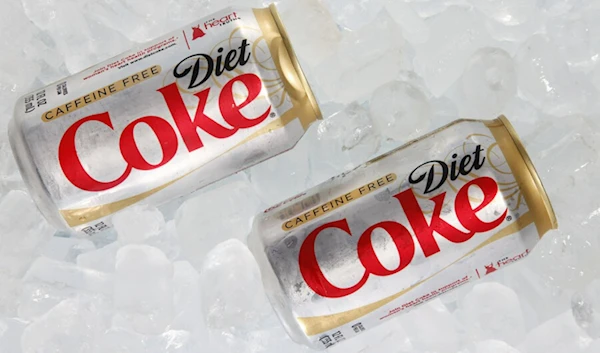 Two cans of Caffeine Free Diet Coke on ice in Surfside, Fla. in 2012. (AP)