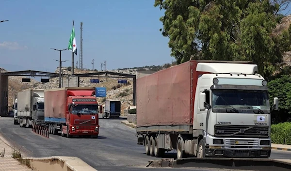 This July 28, 2022 picture shows the entry of a UN aid convoy through the Bab al-Hawa border crossing with Turkey. (AFP)