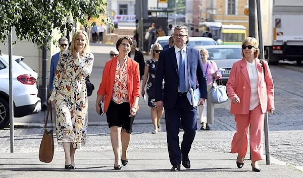 Four parties' leaders which make up the new Finnish government reach the House of the Estates, Helsinki, 16 June 2023. (AFP)