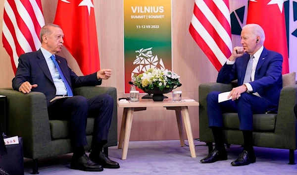 US President Joe Biden and Turkish President Recep Tayyip Erdogan on the sidelines of the NATO summit in Vilnius, Lithuania, Tuesday, July 11, 2023 (AP)