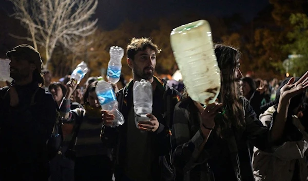 People protest against the high levels of chloride and sodium in the drinking water due to the drought (AFP)