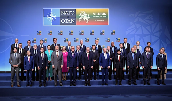 NATO Secretary General Jens Stoltenberg, center, poses for an official family photo with the participants of the NATO Summit in Vilnius, Lithuania, Tuesday, July 11, 2023. (AP)