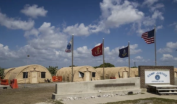 Flags fly in front of the tents of Camp Justice in Guantanamo Bay Naval Base, Cuba, on April 18, 2019. (AP)