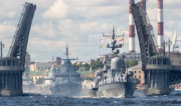 Russian warships sail on the Neva river during the Navy Day parade in Saint Petersburg on July 26, 2020 (AFP)