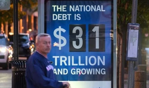 A poster at a bus shelter shows the national debt in Washington, DC in an undated photo (AFP)