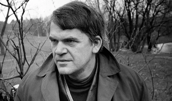 Czech writer Milan Kundera poses in a garden in Prague in October 1973. (AFP)