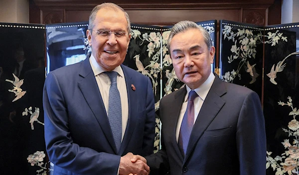 Wang Yi and Lavrov in Jakarta ASEAN (AP)