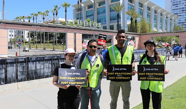 Members of SAG-AFTRA posing before Fox Studios entrance. (Twitter)