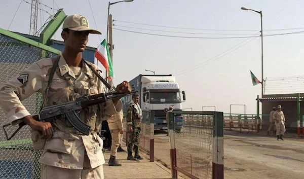 Iranian Border Guard keep watch at a border post in Milak, south-eastern Iran, near the Afghan border. (AFP)