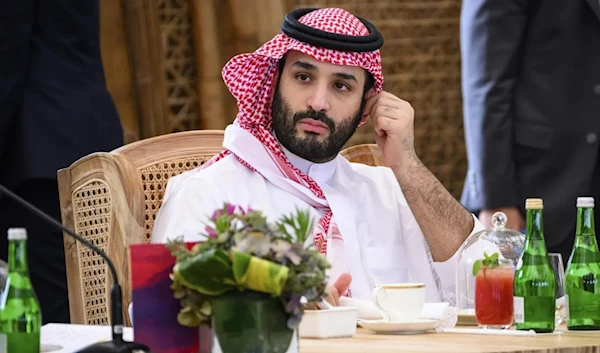 Crown Prince Mohammad Bin Salman takes his seat ahead of a working lunch at the G20 Summit, Tuesday, November 20, 2002. (AP)