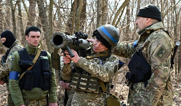 Members of the Ukrainian Forces attend tactical, combat and first aid training course. (AFP)