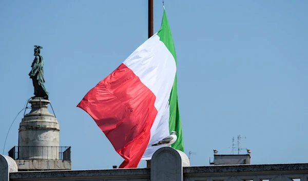 A seagull stands in front of an Italian flag flying at half-mast on the Altare della Patri-Vittorio Emanuele II monument in Rome, Tuesday, March 31, 2020. (AFP Photo)