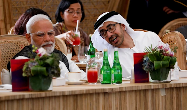 United Arab Emirates Foreign Minister Sheikh Abdullah bin Zayed Al Nahyan, talks with Indian Prime Minister Narendra Modi during a leaders lunch at the G20 summit in Nusa Dua, Bali, Indonesia, November 15, 2022 (AP)