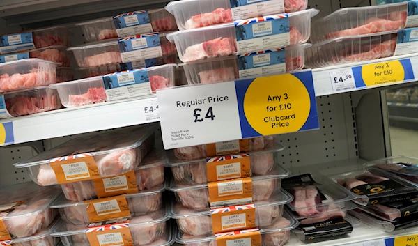 Meat on display in a supermarket showing the latest offers on prices in London, Saturday, June 10, 2023. (AP)