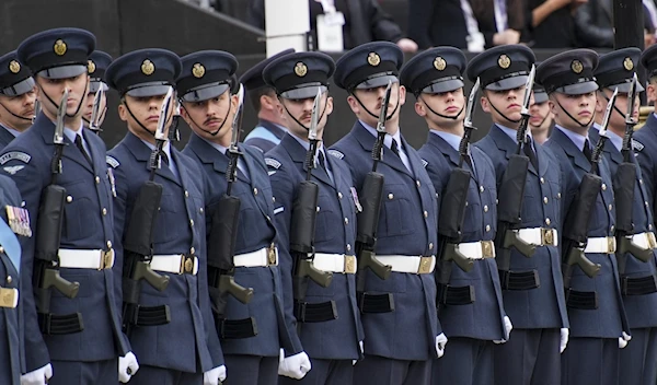 British Royal Air Force personnel react ahead of the funeral service for Queen Elizabeth II, London, Britain, Sept. 19, 2022 (AP)