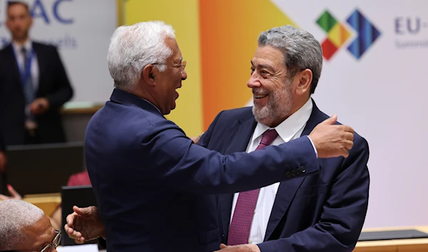 Saint Vincent and the Grenadines Prime Minister Ralph Gonsalves, greets Portugal Prime Minister Antonio Costa during a round table meeting at the third EU CELAC summit , Belgium, Monday, July 17, 2023. (AP )