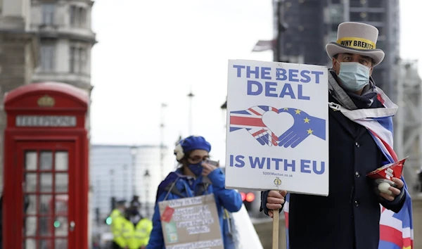 Steve Bray (R), a pro-EU campaigner, during a protest against a Brexit no-deal near Parliament in London, on November 25, 2020. (AP)