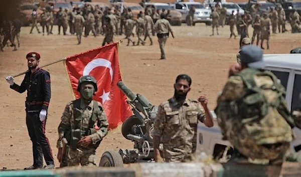 Turkey-backed Syrian fighters gather along the frontlines opposite Kurdish forces near the town of Dadat, 2016 (AFP)