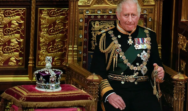 Prince Charles is seated next to the Queen's crown during the State Opening of Parliament, at the Palace of Westminster in London, Tuesday, May 10, 2022 (AP)