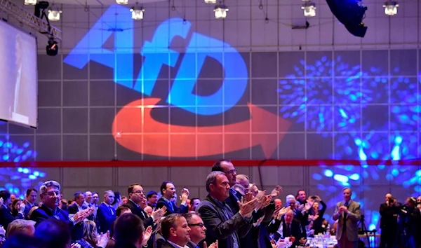 Members of the Islamophobic and anti-immigration Alternative for Germany far-right party applaud during the congress of the party in Hanover, Germany, December 2 2017. (AFP)