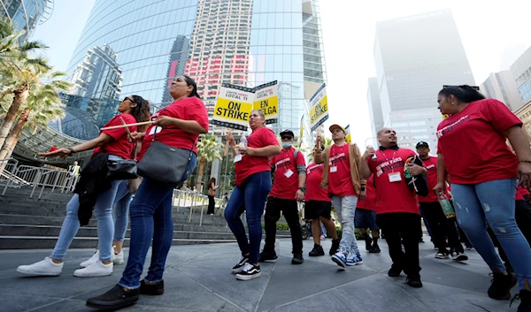 Striking hotel workers rally outside the Intercontinental Hotel after walking off their job early Sunday, July 2, 2023, in downtown Los Angeles. (AP)