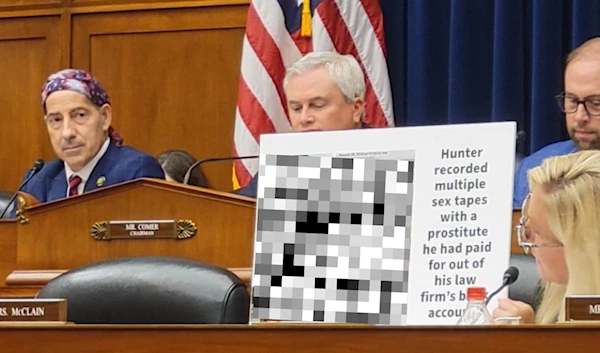 Rep. Marjorie Taylor Greene holds up censored photo of Hunter Biden at the Congress, July 19, 2023 (Social Media)