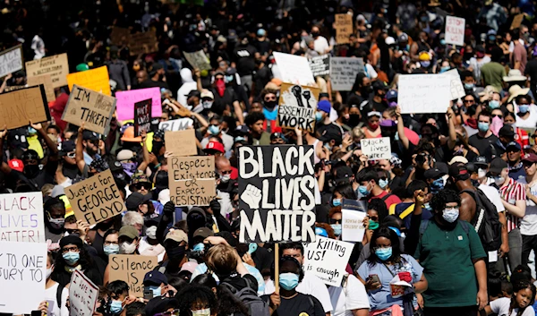 People rally to protest the death of George Floyd in Houston on June 2 2020 (AP)