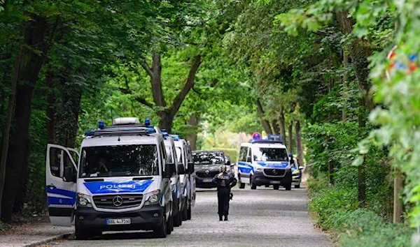 Police officers take part in the search for a wild animal on the loose, reportedly a lioness, in Stahnsdorf, southwest of Berlin, Germany, July 20, 2023 (AFP)