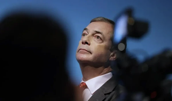 In this Friday, Nov. 22, 2019 file photo, Nigel Farage, Leader of Britain’s Brexit Party, takes his seat after speaking on stage at the launch of the party’s policies for the General Election campaign, in London.  (AP)