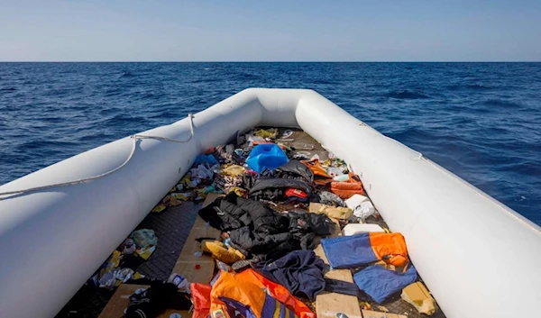 An empty inflatable boat following the rescue of about 90 people by the Spanish NGO Maydayterraneo in the Mediterranean off the Libyan coast on 9 February 2020 (AFP)