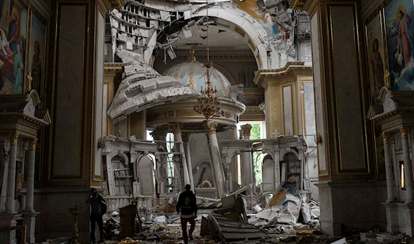 Church personnel inspect damages inside the Odesa Transfiguration Cathedral in Odesa, Ukraine, Sunday, July 23, 2023. (AP)